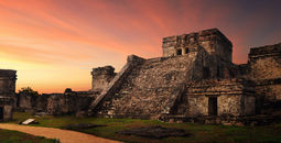 Castillo fortress at sunset in the ancient Mayan city of Tulum, Mexico (photo via Soft_Light / iStock / Getty Images Plus)