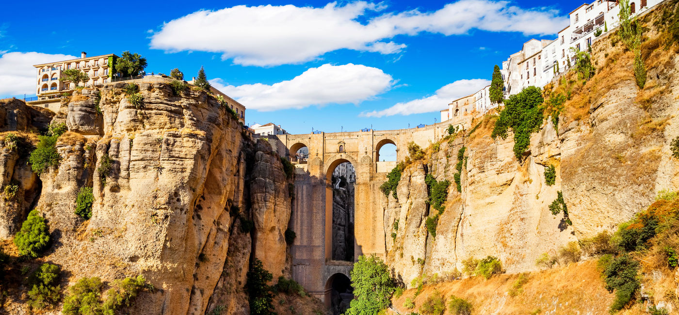 Image: Panoramic view of the old city of Ronda, one of the famous white villages in the province of Malaga, Andalusia, Spain (photo via MarquesPhotography / iStock / Getty Images Plus)