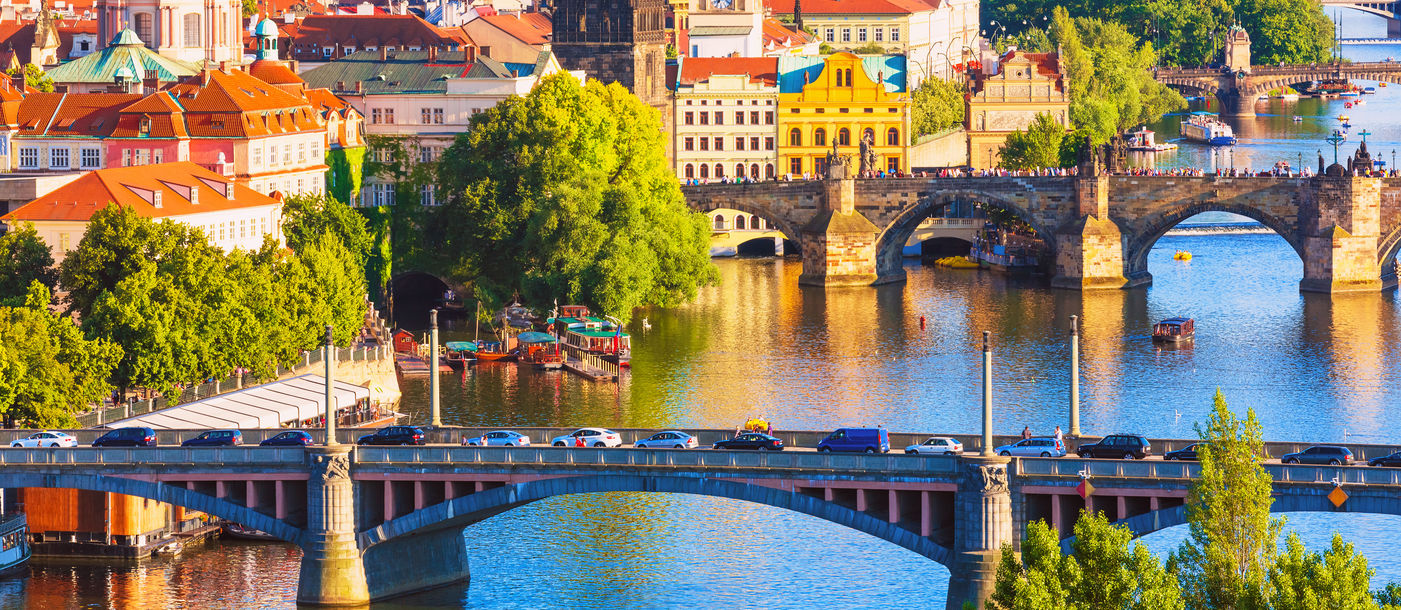 Scenic summer aerial view of the Old Town pier architecture and Charles Bridge over Vltava river in Prague, Czech Republic (Photo via scanrai / iStock / Getty Images Plus)