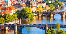 Scenic summer aerial view of the Old Town pier architecture and Charles Bridge over Vltava river in Prague, Czech Republic (Photo via scanrai / iStock / Getty Images Plus)