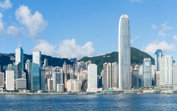 Hong Kong view from Victoria Harbour.  (photo via leungchopan/iStock/Getty Images Plus)