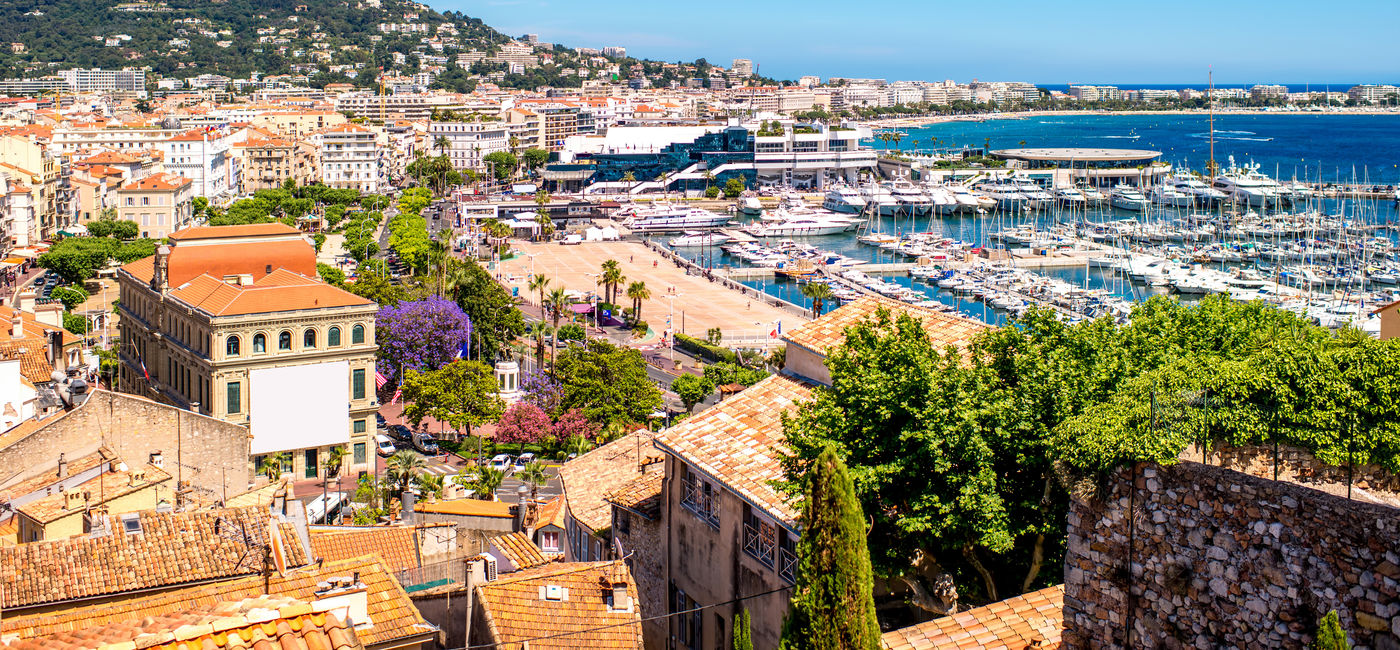 Image: Top cityscape view on french riviera with yachts in Cannes city (Photo via  RossHelen / iStock / Getty Images Plus)