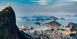 Aerial view of Rio De Janeiro. Corcovado mountain with statue of Christ the Redeemer, urban areas of Botafogo, Flamengo and Centro, Sugarloaf mountain. (photo via microgen / iStock / Getty Images Plus)