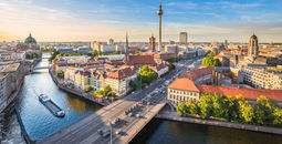 Aerial view of Berlin skyline with famous TV tower and Spree river in beautiful evening light at sunset, Germany. (photo via bluejayphoto/iStock/Getty Images Plus)
