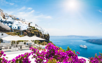 Santorini island, Greece. Beautiful view on the sea (photo via Olga_Gavrilova / iStock / Getty Images Plus)