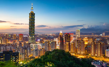View of the Taipei Skyline with Taipei 101 at night (photo via Sean3810 / iStock / Getty Images Plus)