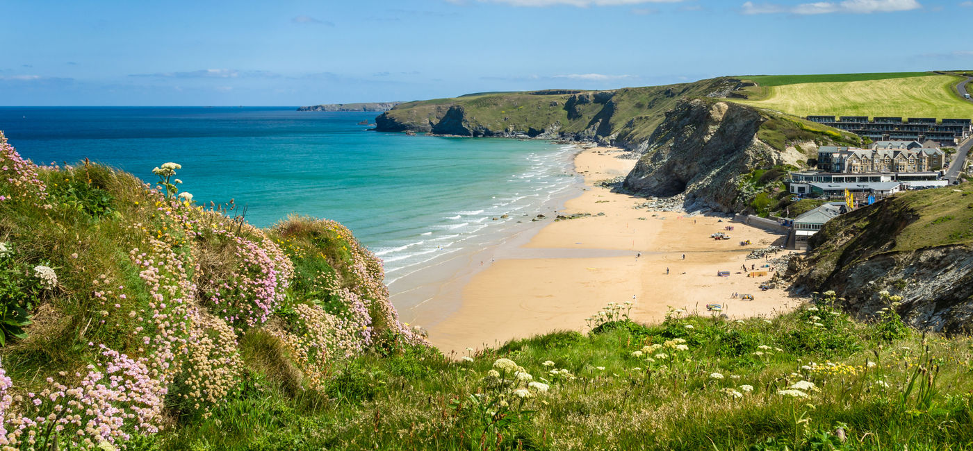 Image: PHOTO: A Stretch of Coast in Cornwall with a Sandy Beach at the foot of high cliffs. (Photo via AlbertPego / iStock / Getty Images Plus)