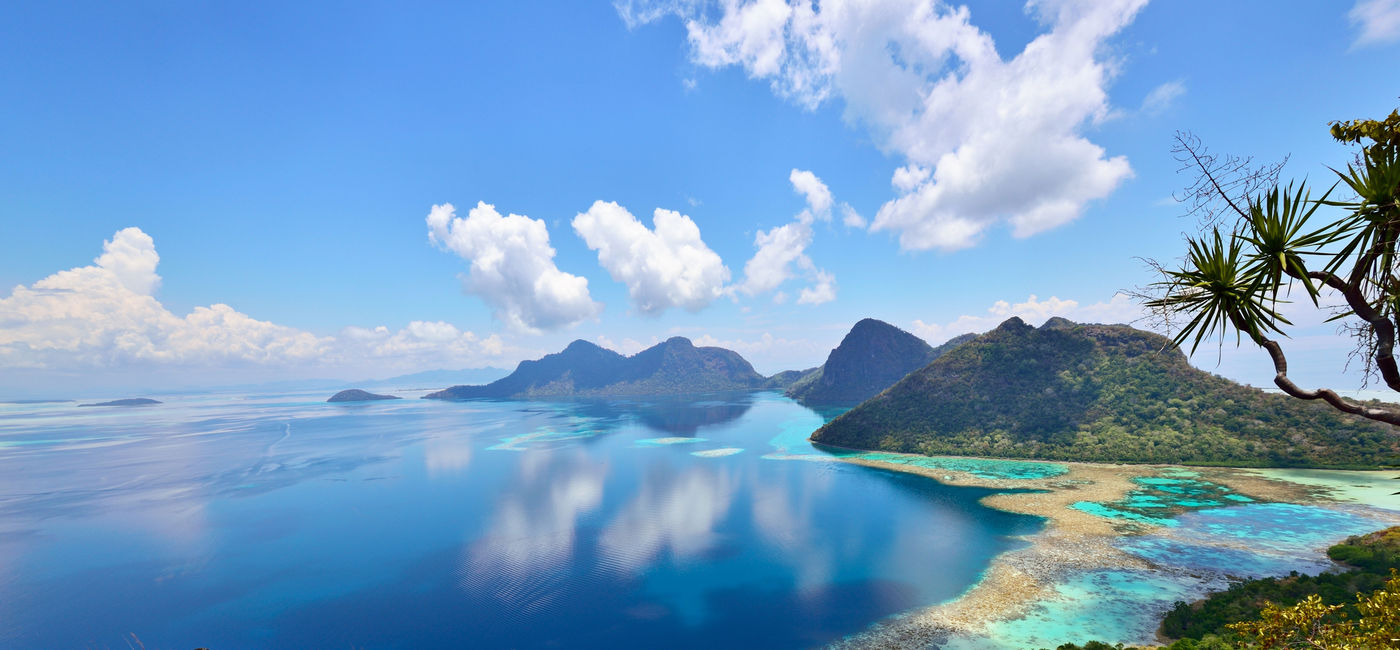 Image: Scenic view of Bohey Dulang Islands, and ancient volcano in Tun Sakaran Marine National park, Semporna, Sabah Borneo, Malaysia.  (photo via Cn0ra / iStock / Getty Images Plus)