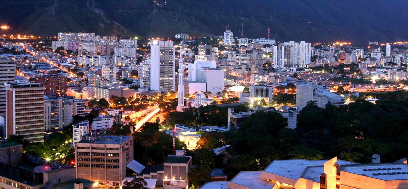 Image: Caracas cityscape at twilight with Avila mountain behind. (Photo via Alfredo Allais / iStock / Getty Images Plus)