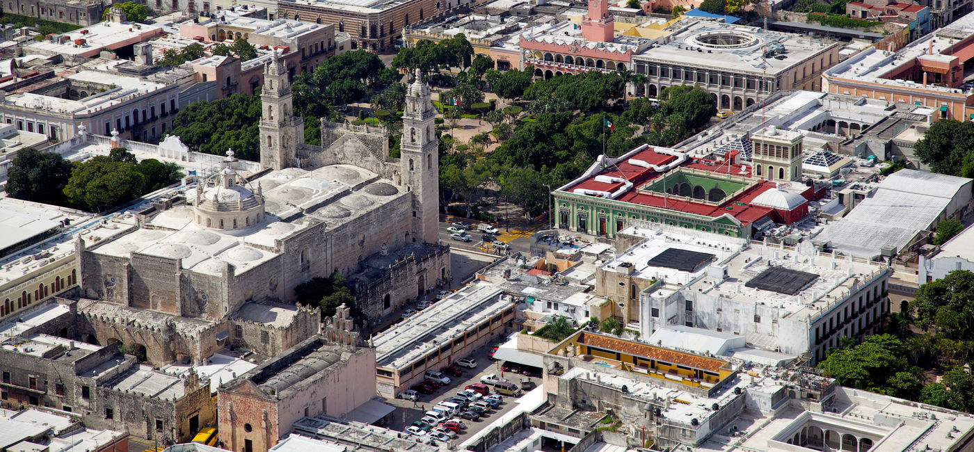 Image: PHOTO: Aerial view of downtown Merida, Yucatan's city square and cathedral. (photo via segarza / iStock / Getty Images Plus)