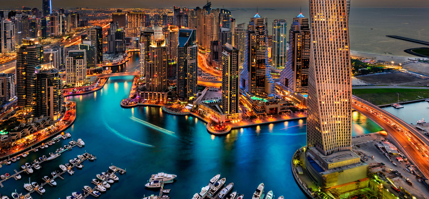 Image: Dubai Marina from a high view showing the boats, sea and the cityscape. (photo via JandaliPhoto / iStock / Getty Images Plus)