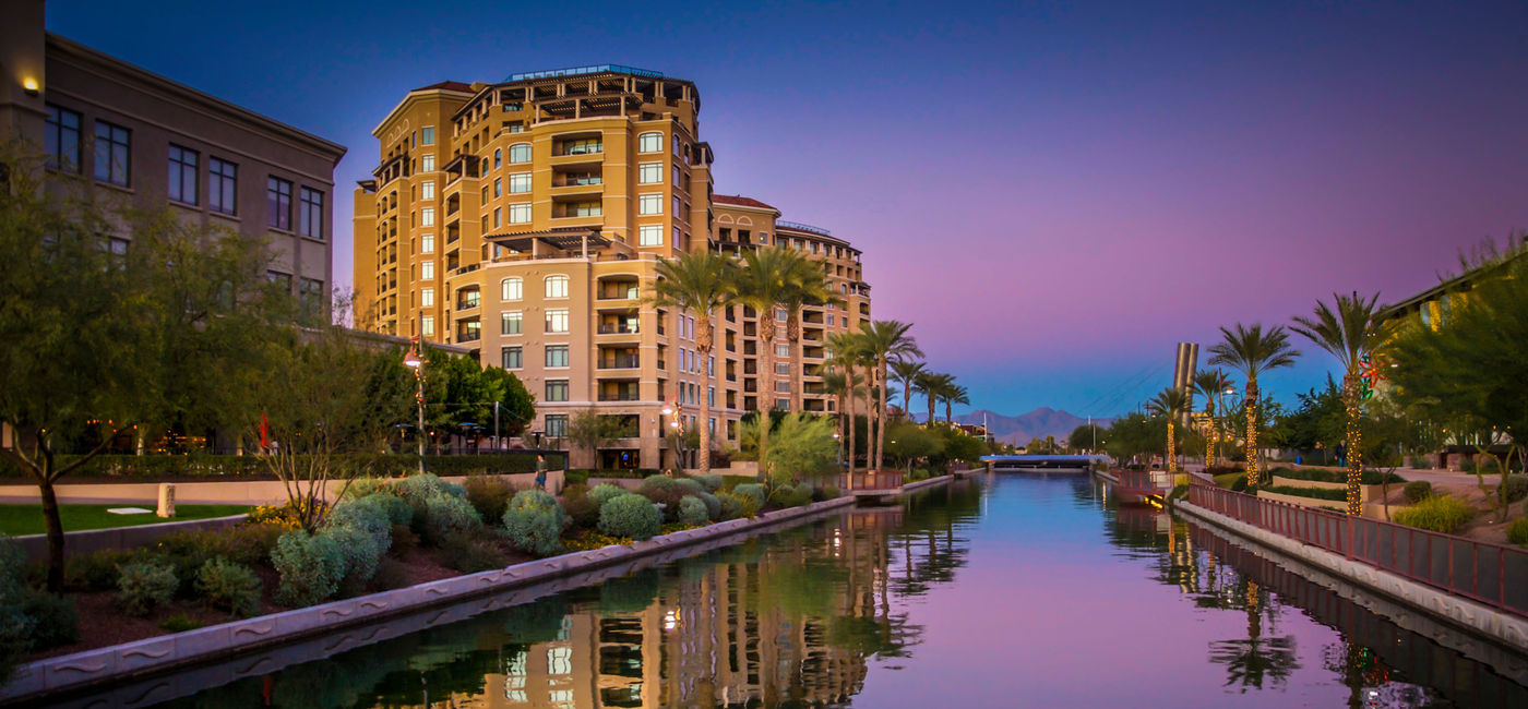 Image: The Arizona Canal running through Scottsdale,Az,USA at sunset (photo via BCFC / iStock / Getty Images Plus)