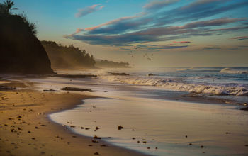 Sunrise at Pacific beach, Riviera Nayarit, Mexico (photo via La_Corivo / iStock / Getty Images Plus)