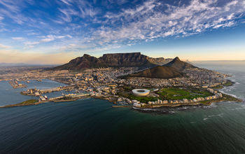 Vintage shot of a Beautiful beach in Cape Town, with Lion's Head mountain (Photo via vwPix/ iStock / Getty Images Plus)