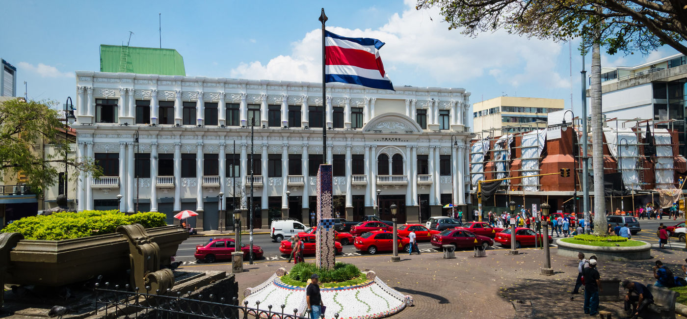 Image: Town square in San Jose with Costa Rica flag (photo via Esdelval / iStock / Getty Images Plus)