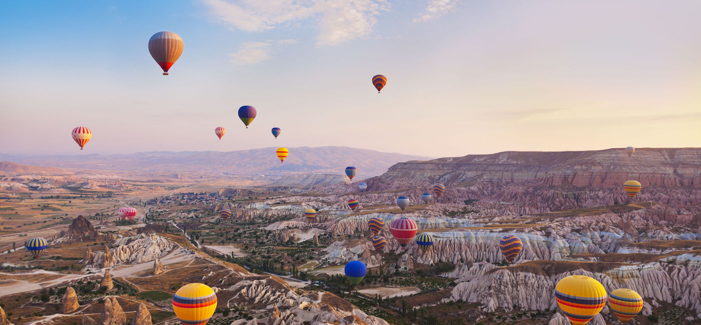 Image: Hot air balloons flying over Cappadocia, Turkey. (photo via TPopova/iStock/Getty Images Plus) (TPopova / iStock / Getty Images Plus)