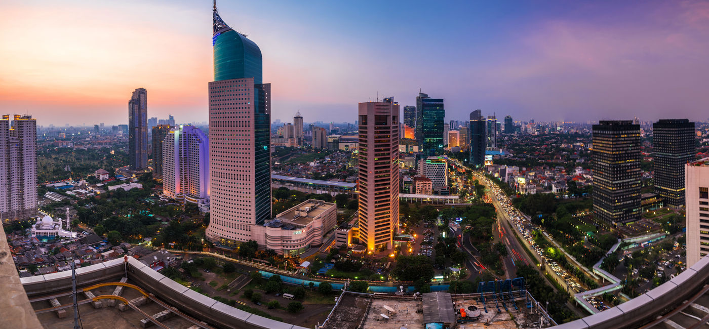 Image: Jakarta Skyline at dawn with the iconic building. The building is one of the most highest building in Indonesia. (photo via AlfinTofler / iStock / Getty Images Plus)