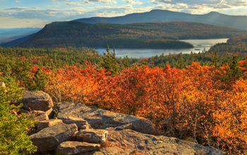 Afternoon sun on sunset rock in the Autumn, overlooking North-South Lake in the Catskills Mountains of New York. (HDR).' (lightphoto / iStock / Getty Images Plus)