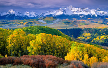 Autumn aspens and Wilson Peak in the San Miguel Range - southwestern Colorado. (Phoot via sneffelsclimber / iStock / Getty Images Plus)