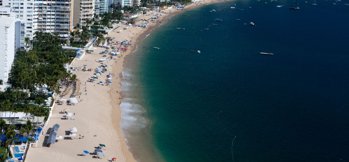 Image: Overlooking view of Acapulco Bay, Mexico. (photo via Aneese/iStock/Getty Images Plus)