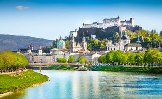 Beautiful view of Salzburg skyline with Festung Hohensalzburg and Salzach river in summer, Salzburg, Salzburger Land, Austria.