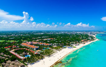 Playa del Carmen aerial view of the beautiful white sand beaches and blue turquoise water of the Caribbean ocean (Photo via HT-Pix / iStock / Getty Images Plus)