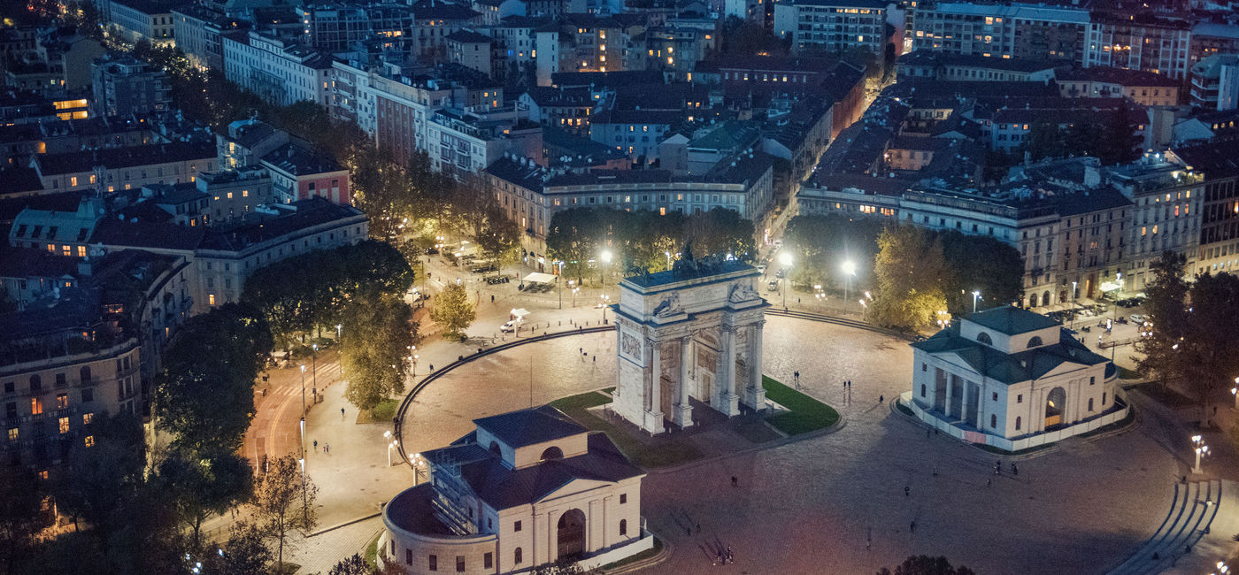 Image: PHOTO: Panoramic view of Milan at night. (photo via Grosescu Alberto Mihai / iStock / Getty Images Plus)