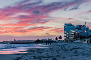 Sunset scene of beach and coastline of Montevideo, Uruguay (Rudimencial / iStock / Getty Images Plus)