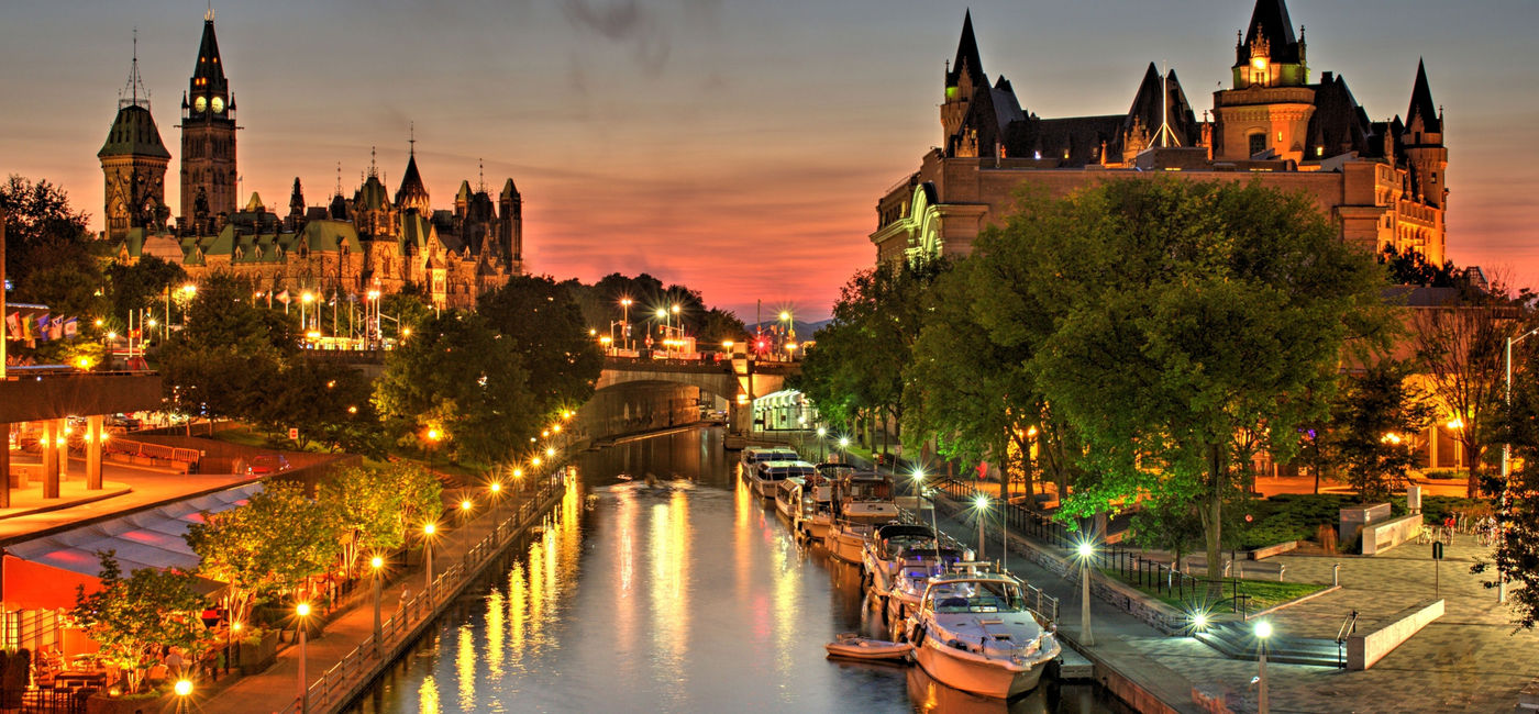 Image: A beautiful warm orange-red glow fills the sky at dusk over Ottawa Canada during a July evening. (photo courtesy Getty Images) (TonyIaniro / iStock / Getty Images Plus)