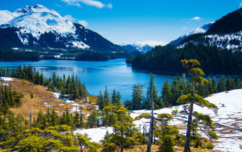 Snow melts slowly from the mountains as spring approaches at the end of May in south-central Alaska (photo via troutnut/iStock/Getty Images Plus)