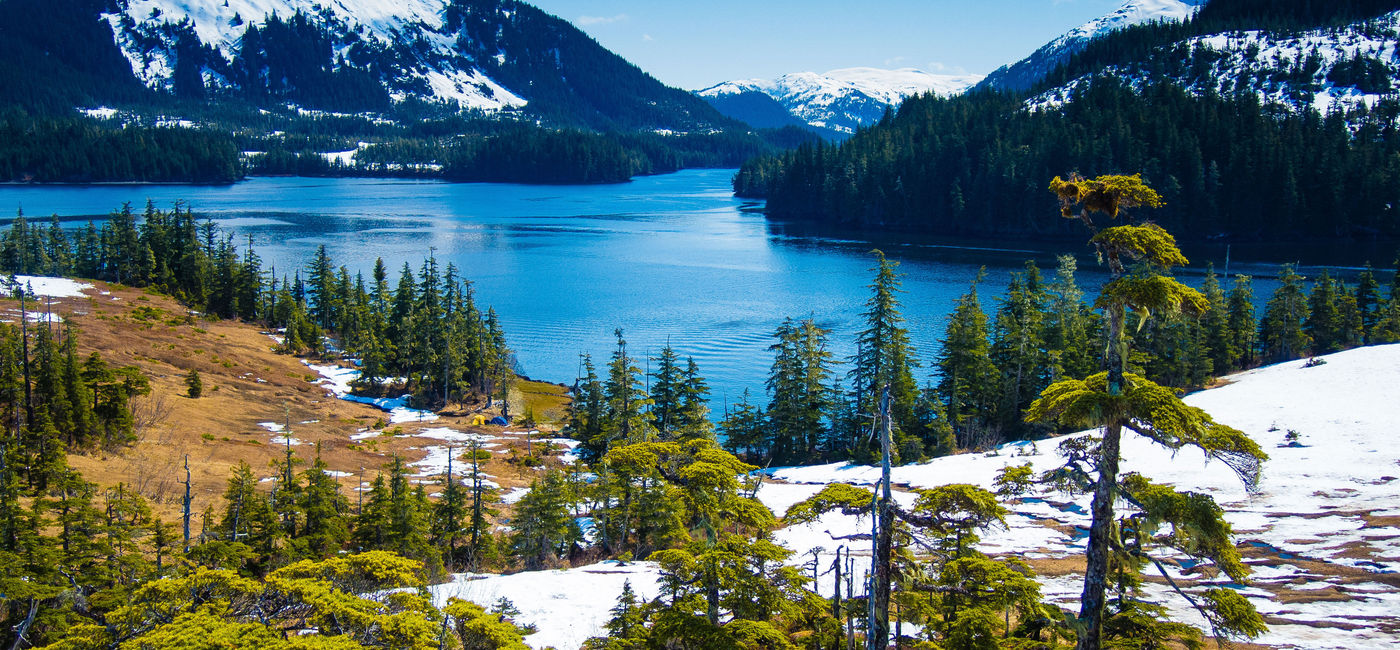 Image: Snow melts slowly from the mountains as spring approaches in south-central Alaska. (photo via troutnut/iStock/Getty Images Plus)