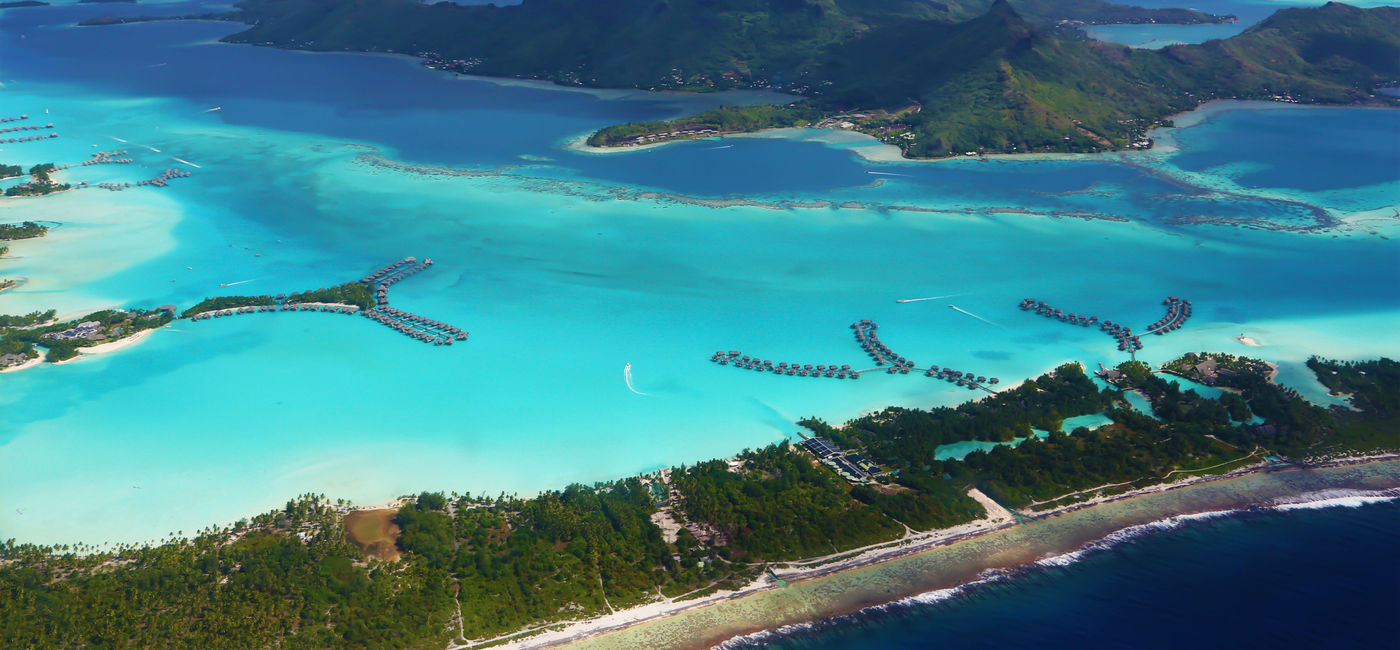 Image: Some luxury resorts with their overwater bungalows are clearly visible (Photo via Manakin / iStock / Getty Images Plus)