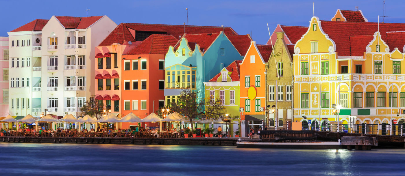 View of downtown Willemstad at twilight. Curacao, Netherlands Antilles (Photo via sorincolac / iStock / Getty Images Plus)
