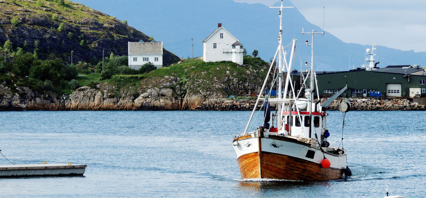 Image: A fishing boat comming into the port of Bodø Norway. (Photo via Audun Brestrup / iStock / Getty Images Plus)