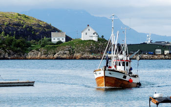 A fishing boat comming into the port of Bodø Norway. (Photo via Audun Brestrup / iStock / Getty Images Plus)