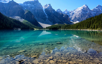 The Moraine Lake in Banff National Park, Alberta, Canada on a mid-summer morning (photo via Vinay_Bavdekar/iStock/Getty Image Plus)