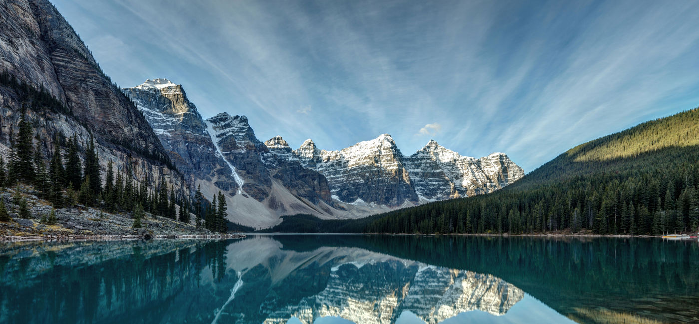 Image: Moraine Lake reflection on a calm morning in Banff National Park, Alberta, in the heart of the Canadian Rockies. (photo via P_L_photography/iStock/Getty Images Plus)