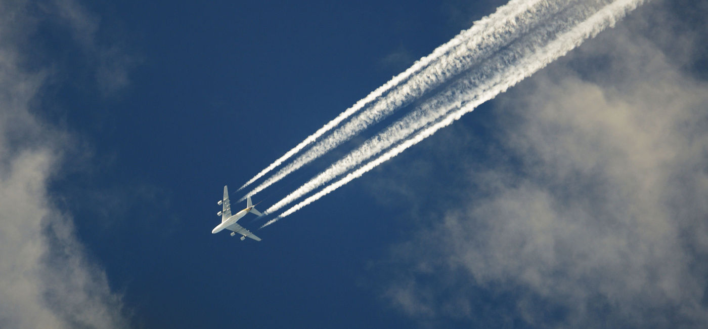 Image: Airplane emissions. (photo via Jordanlye / iStock / Getty Images Plus)