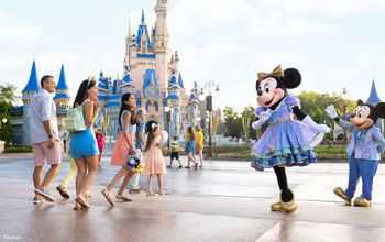 Minnie and Mickey greet park guests at Walt Disney World.