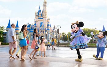Minnie and Mickey greet park guests at Walt Disney World.