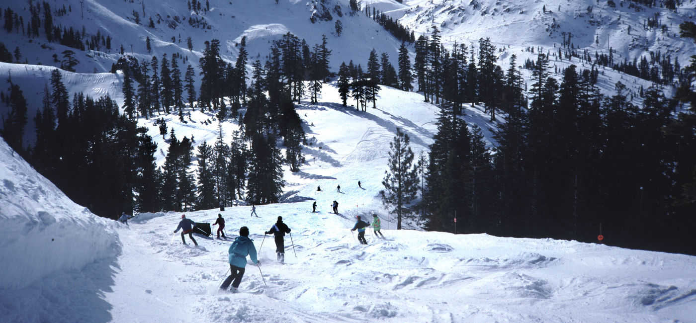 Image: Skiers at Palisades Tahoe in California (Photo via Coast-to-Coast / iStock / Getty Images Plus)