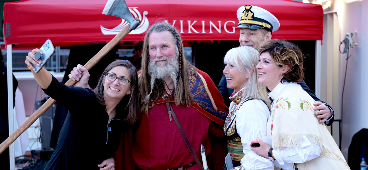 Image: Three Viking “godsisters," from left Nicole Stott, Karine Hagen, and Sissel Kyrkjebø, with Capt. Erik Saabye and Geir Rovik, a Norwegian traditional longship builder. (Photo courtesy of Viking)