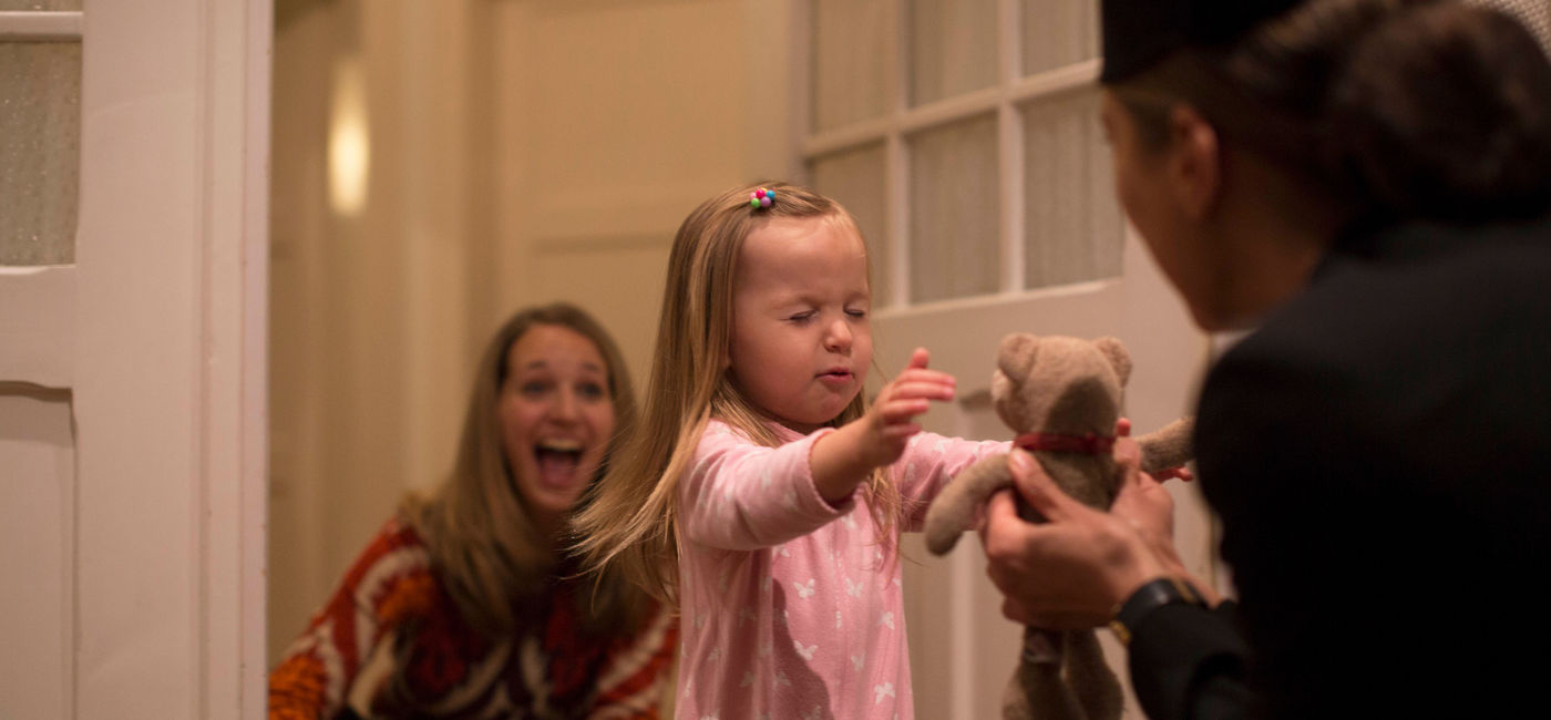 Image: Little Norah is reunited with “Bear.”  (Air New Zealand)