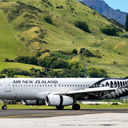 Airplane of Air New Zealand takes off from airport