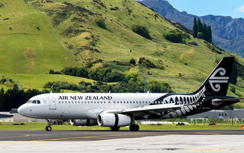 Airplane of Air New Zealand takes off from airport