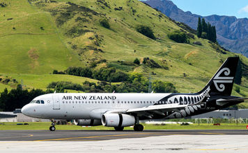 Airplane of Air New Zealand takes off from airport