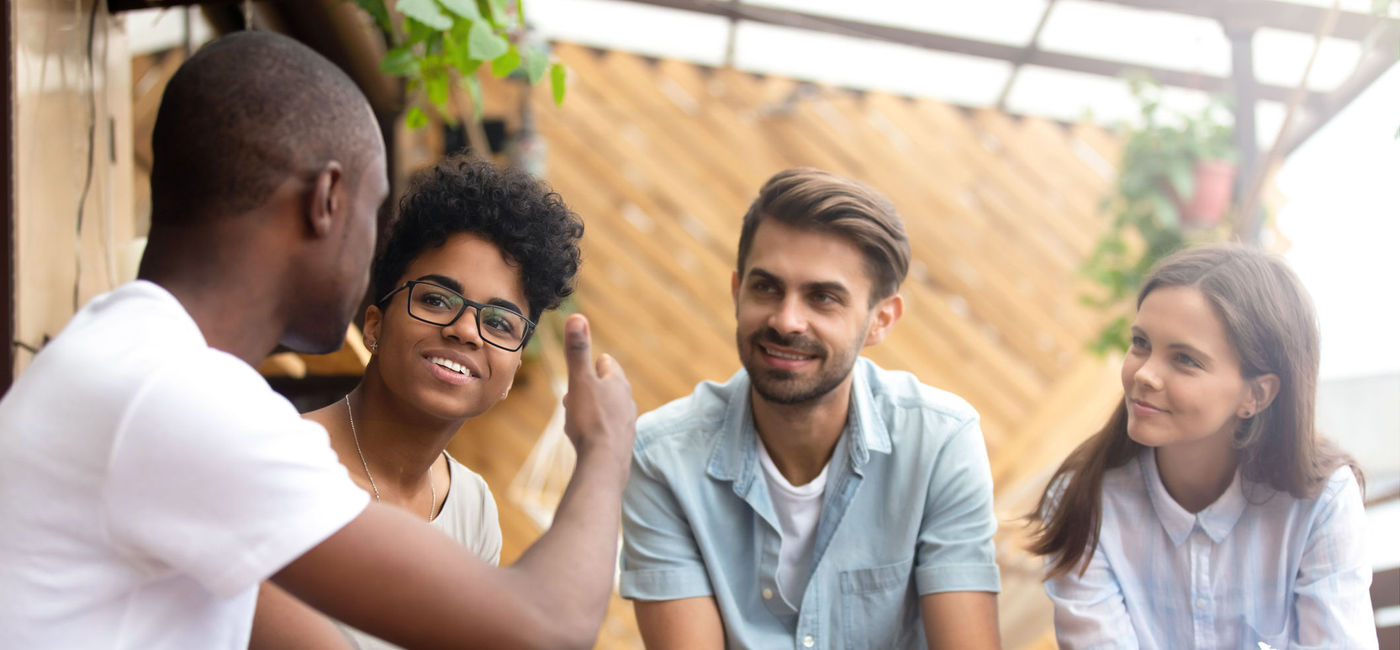 Image: Group of friends talking over coffee. (Photo via Getty Images Plus / iStock / fizkes)