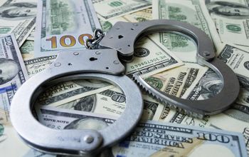 handcuffs on money