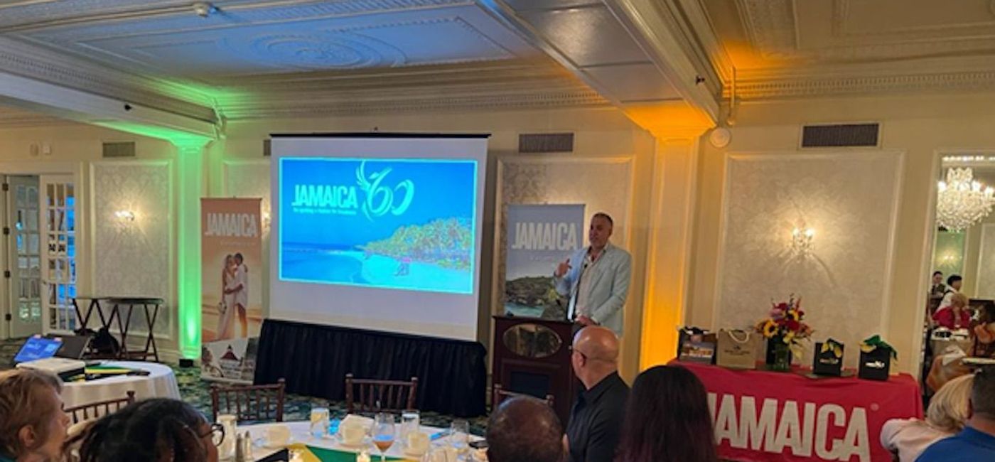 Image: Philip Rose, the JTB's director, Northeast USA chatting with travel advisors during the Northeast Roadshow. (photo via Jamaica Tourist Board)