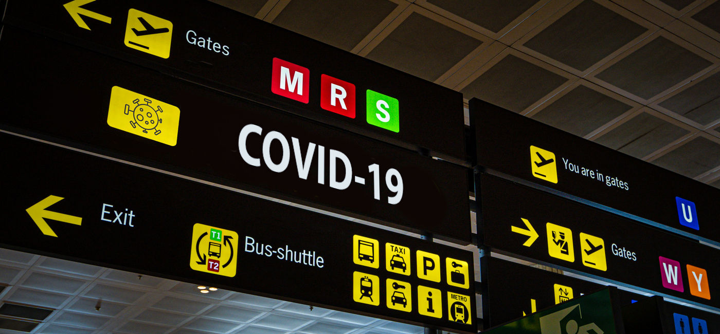 Image: Authorities had just an hour to stop a mom and son who were COVID positive from boarding a plane. (photo via Tanaonte / iStock / Getty Images Plus)